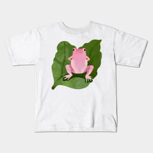 Pink frog in the middle of a green leaf Kids T-Shirt